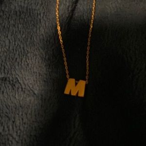 M gold necklace
